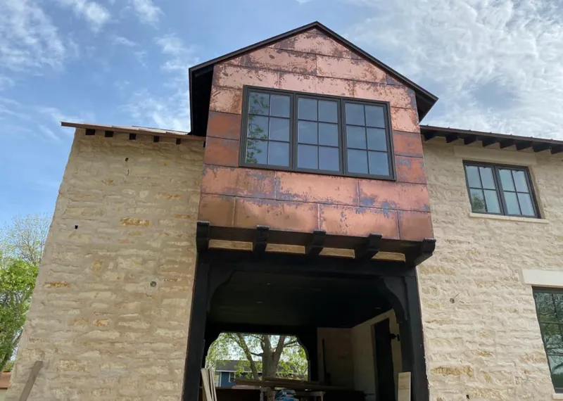 Copper metal panel facade on a stone building for Skylight Installation in Wesley Chapel